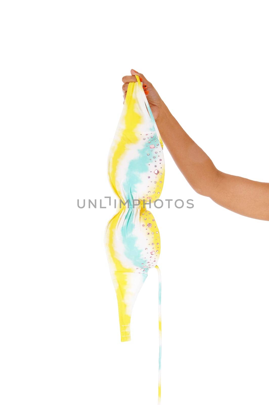A close up image of the arm of a woman holding a bra from a bikini, .isolated for white background.