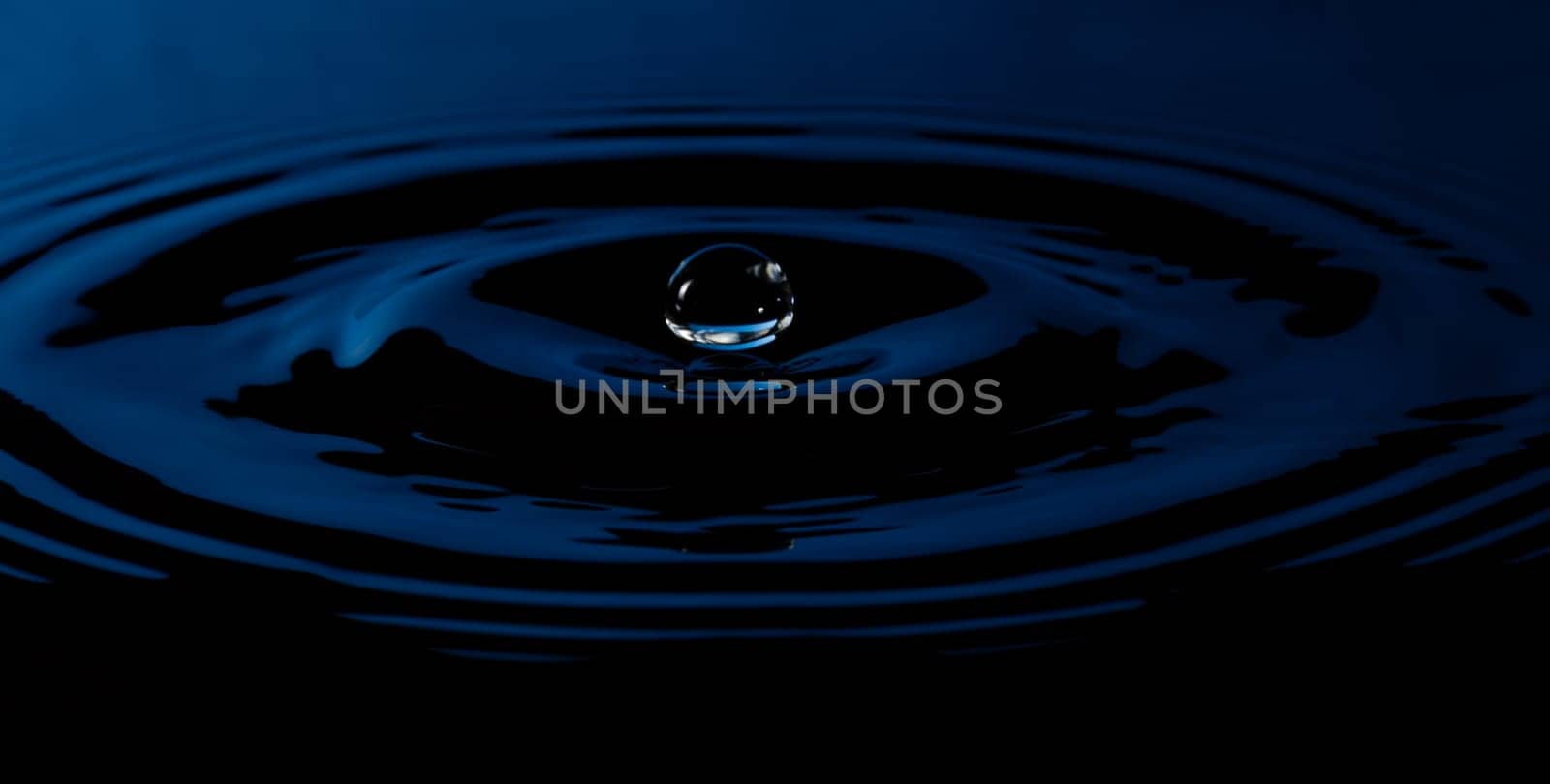 Water Droplet with Ripples blue and black.