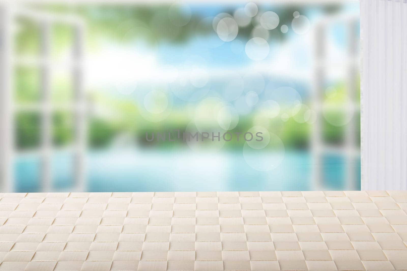 Table top on sunny beach background. A empty bright table on blurred abstract beach with  blue sky and bokeh lights. Template for your product display montage. Summer and holiday concept.