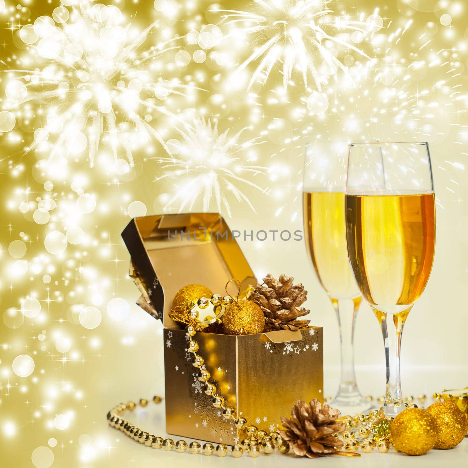 Glasses of champagne on sparkling holiday background with fireworks