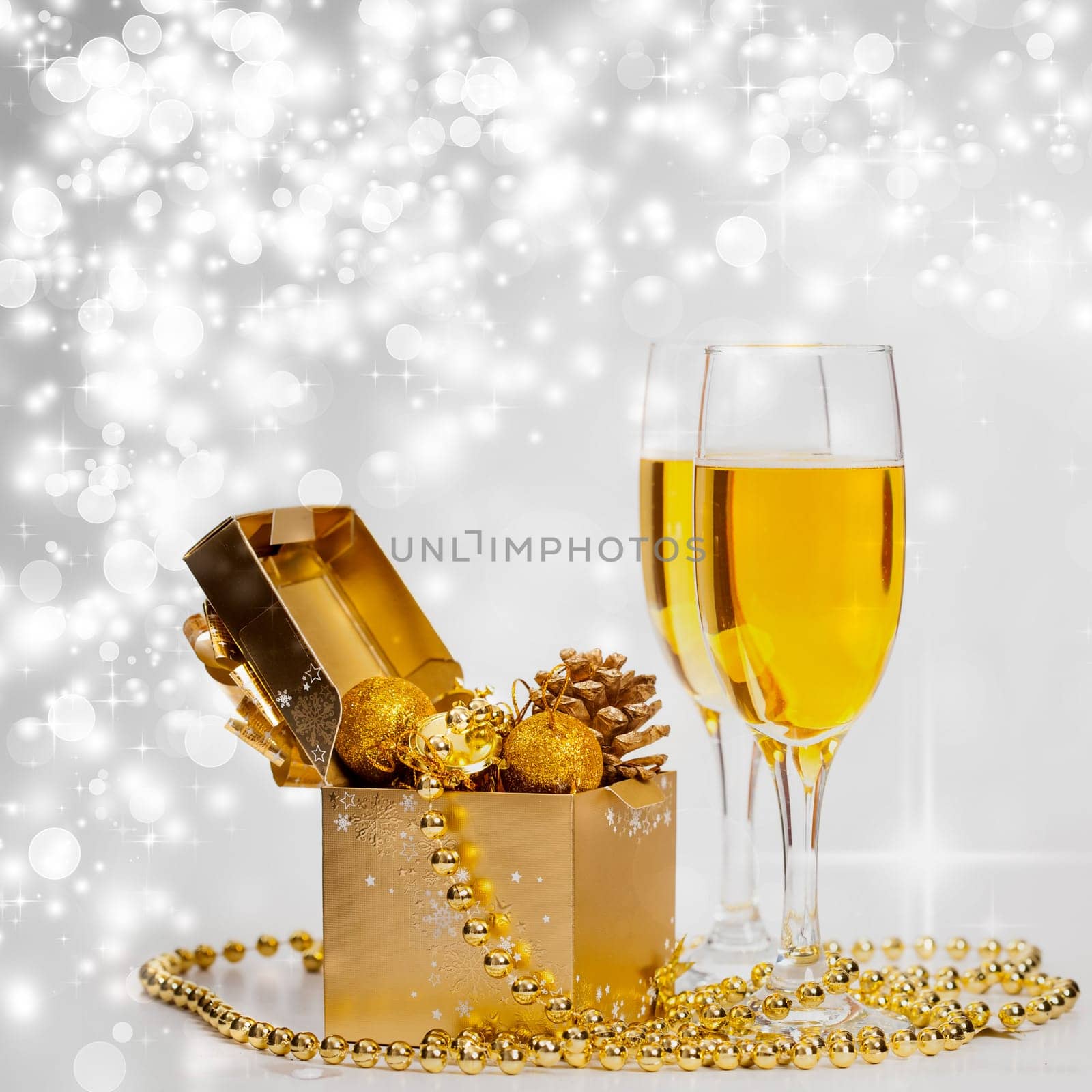 Glasses of champagne on sparkling holiday background with fireworks