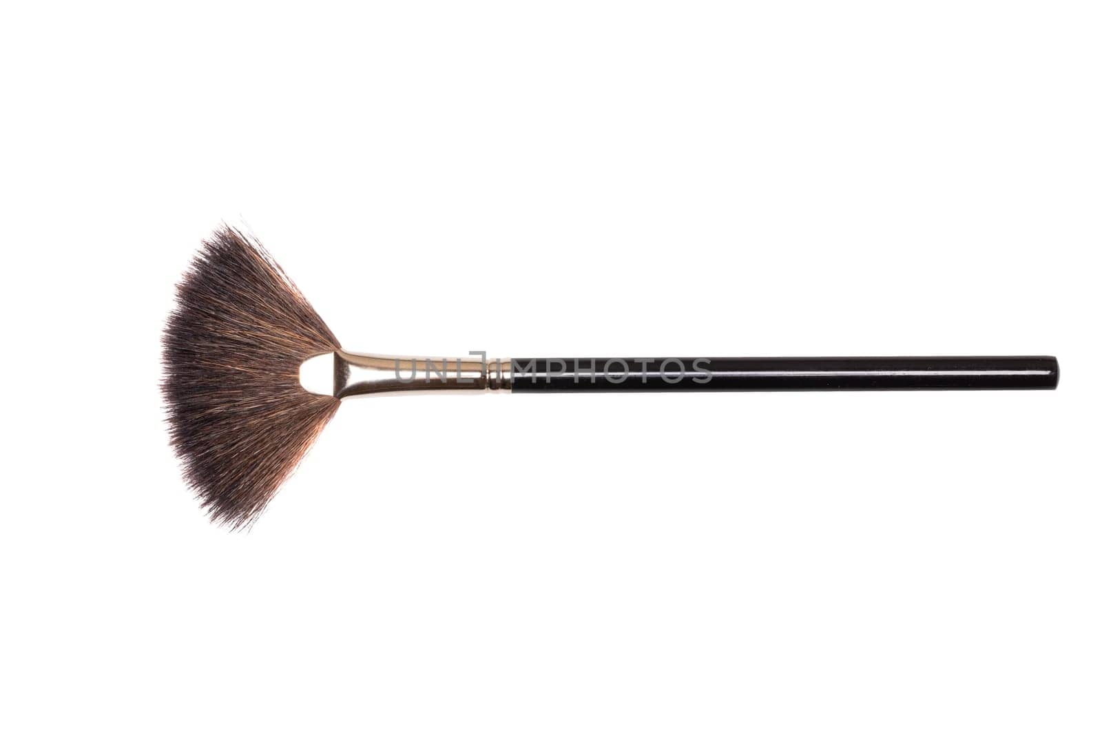 Beauty products. Closeup of a make-up brush isolated an a white background. Makeup cosmetic tools. Macro.