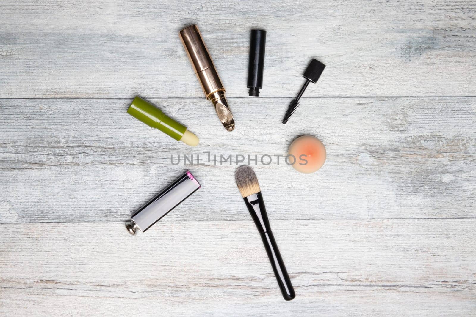 Cosmetic makeup set. Decorative compostion of cosmetics on rustic bright wooden table. Woman accessories on background with copy space.