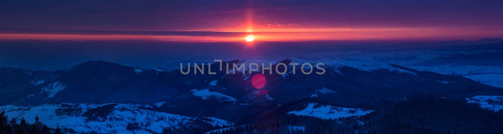 Beautiful sunrise in winter mountains of Transylvania