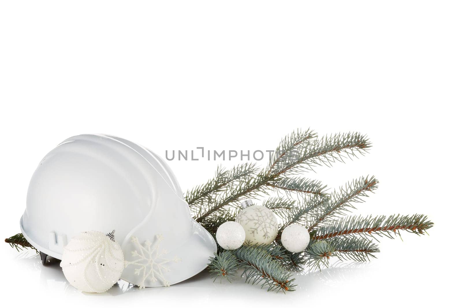 Construction hard hat, fir tree branches and Christmas ornament isolated on a white background. New Year and Christmas. Horizontal view.