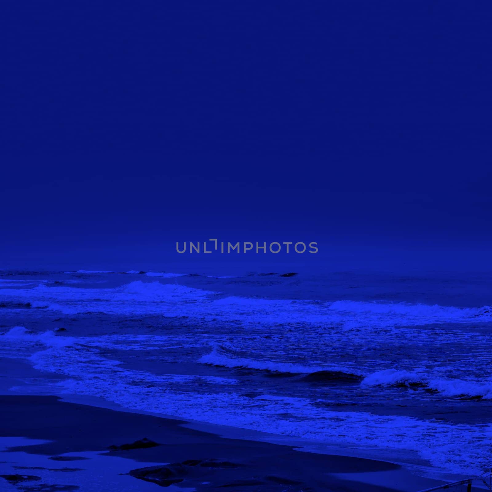 seascape image of waves on sea over stormy sky