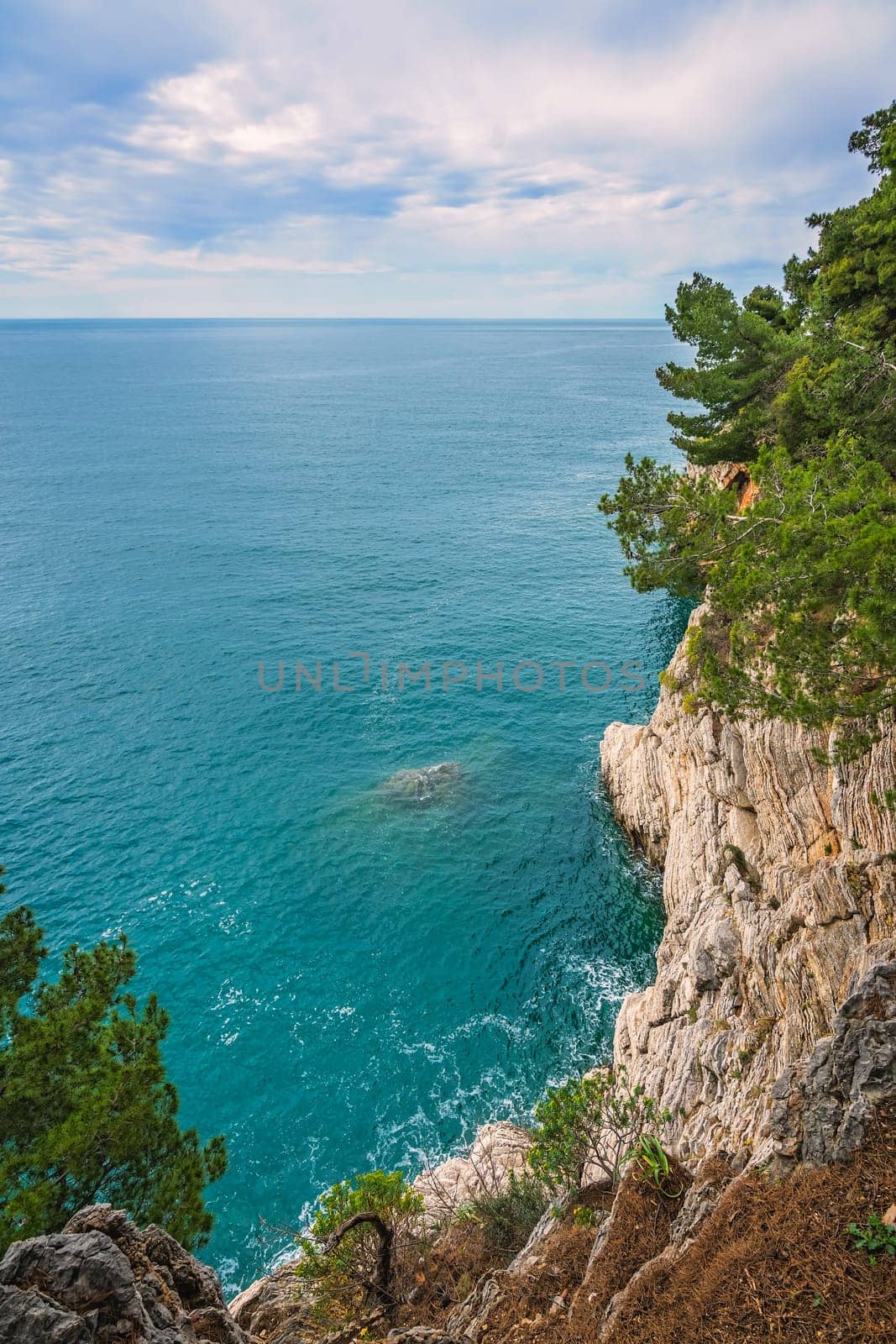 Beautiful high cliffs in Petrovac bay, on the coast in Montenegro