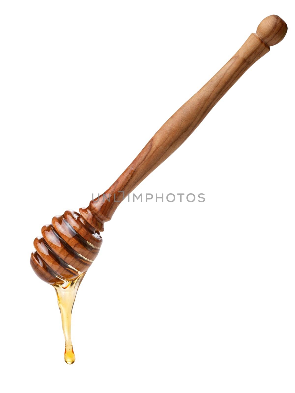 Wooden honey dipper with dripping honey. Large depth of field,clipping path