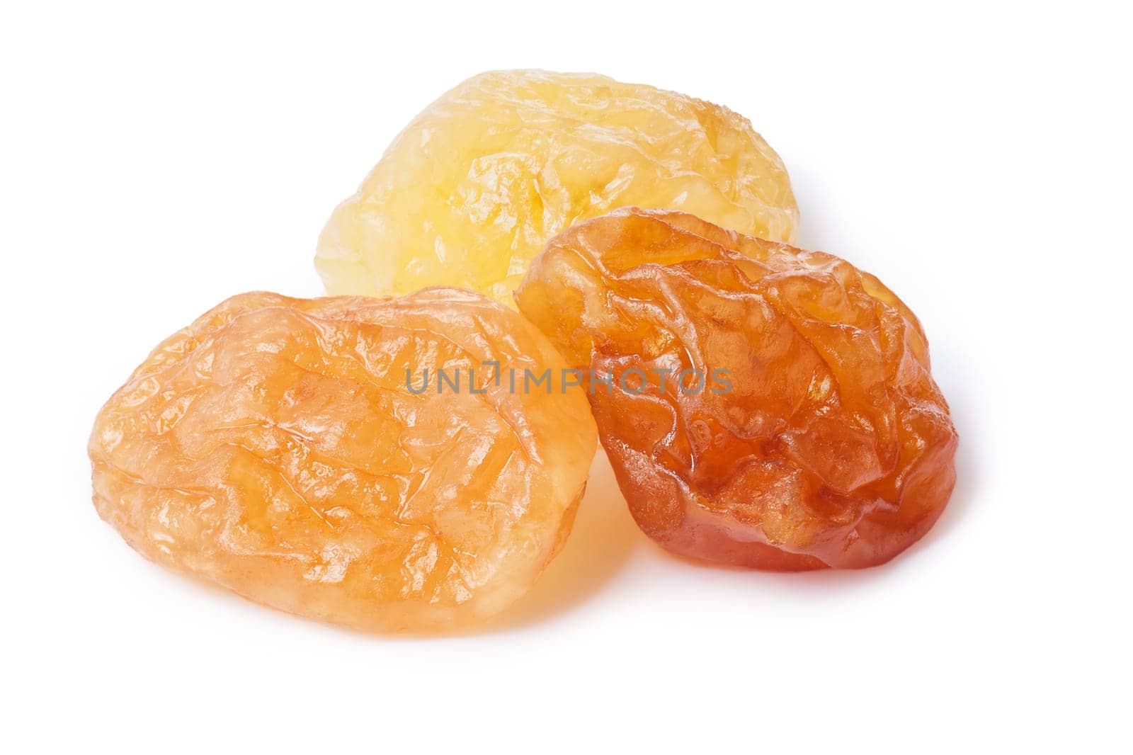 Golden natural seedless raisins from California. Dried treated grapes. Retouched, large depth of field