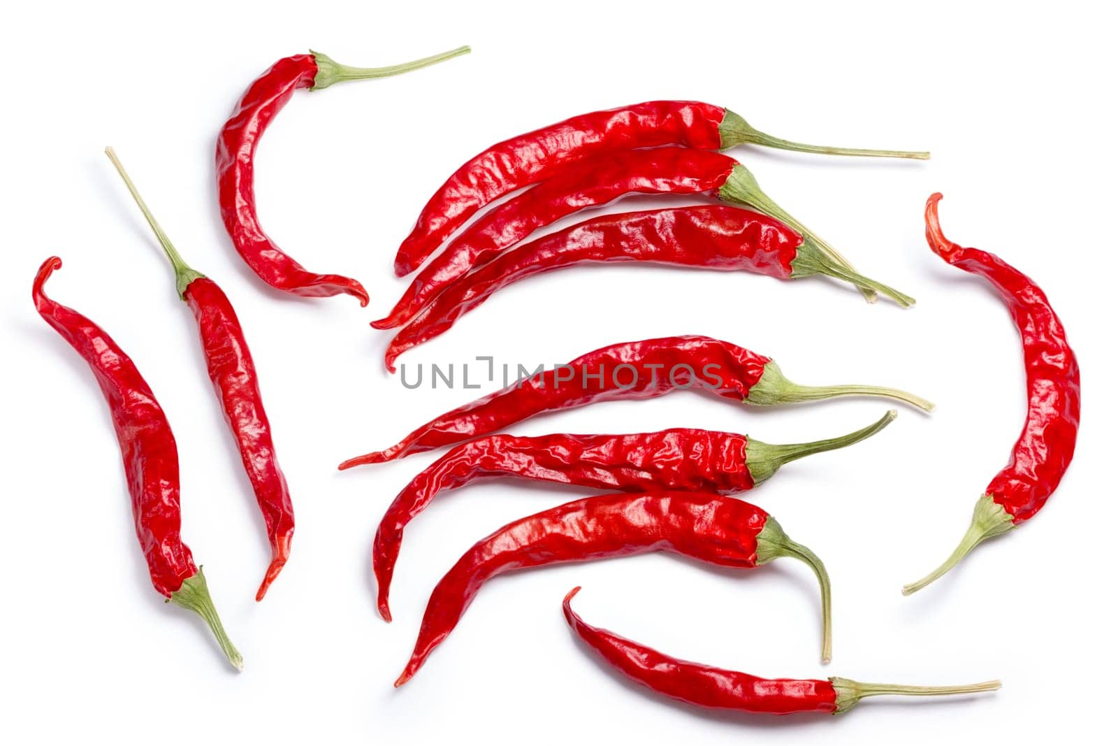 Dried De Arbol chiles, single pods, whole. Clipping paths, shadow separated, top view