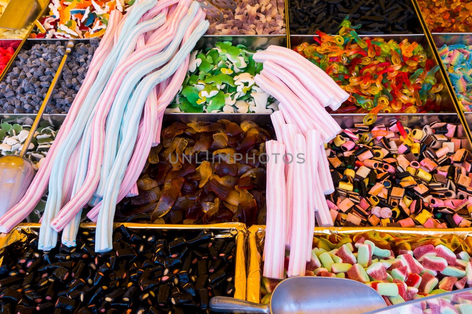 Caramel sweets and Bonbons. Retail. Collection of colorful gummy candies at market
