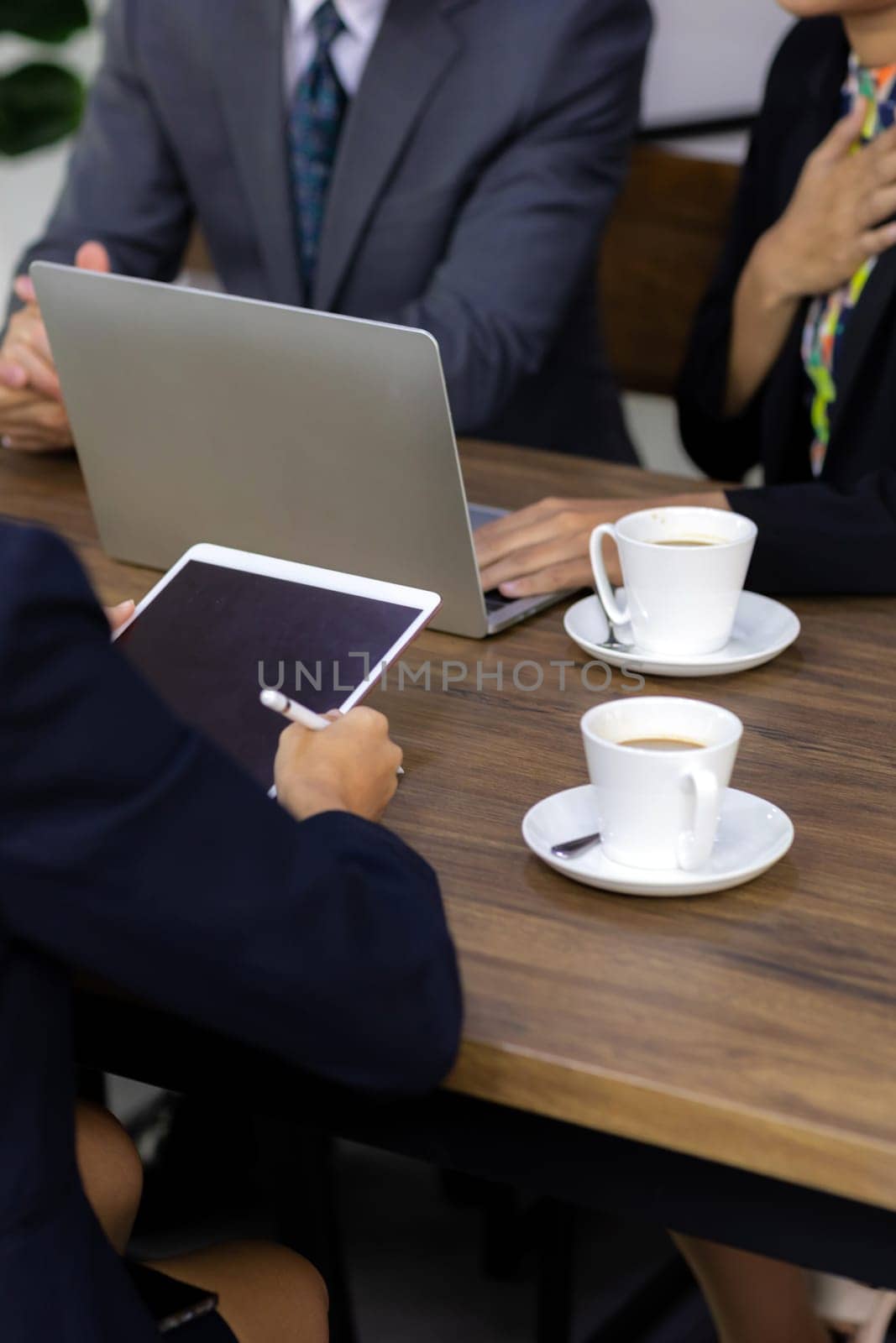 Business team have a meeting in a cafe