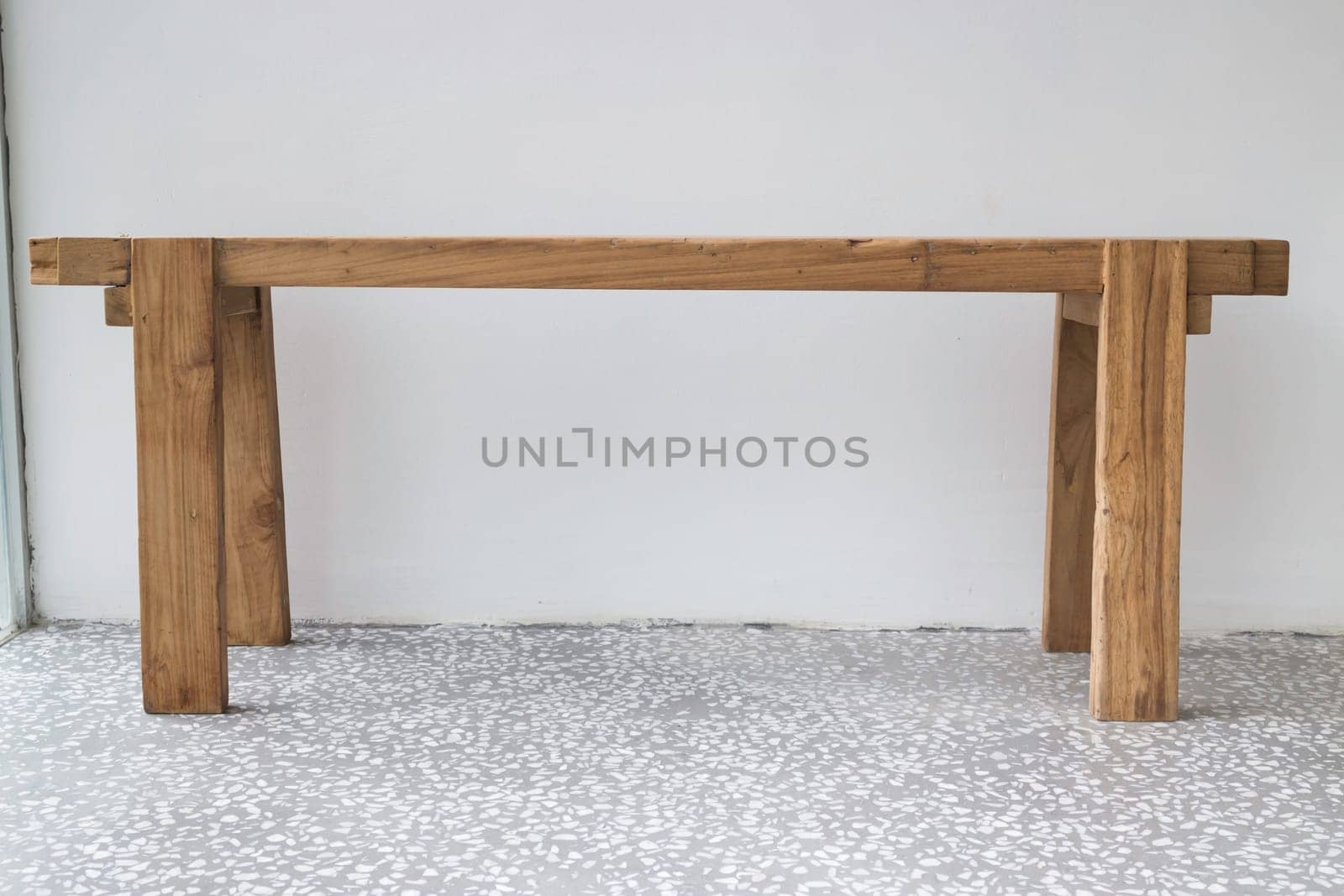 Single wooden bench in the room, stock photo