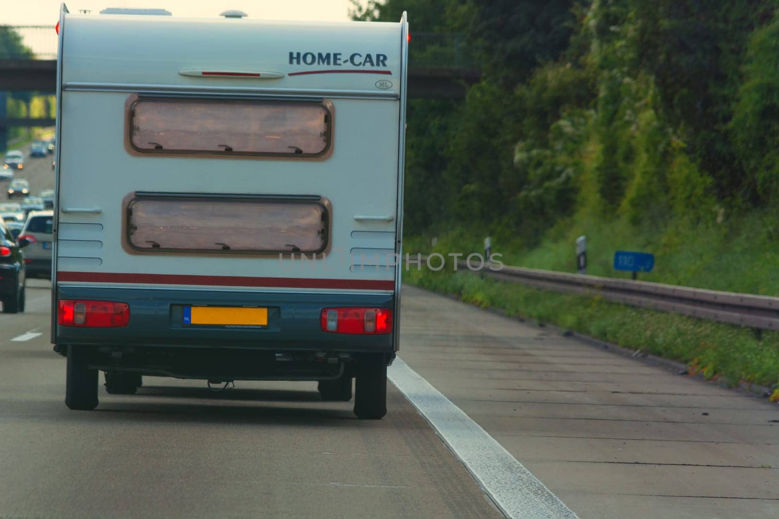 MOTORWAY A 61  GERMANY - AUGUST 13  2017:.Caravan on the A 61 motorway in tourist traffic near the city Grafschaft.