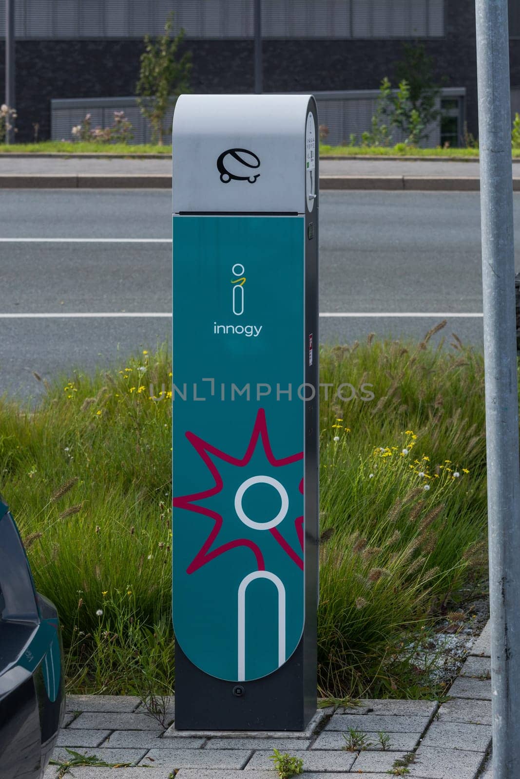 HEILIGENHAUS, NRW, GERMANY - AUGUST 24, 2017: Parking in Heiligenhaus charging of modern electric car on the road is the future of the automobile