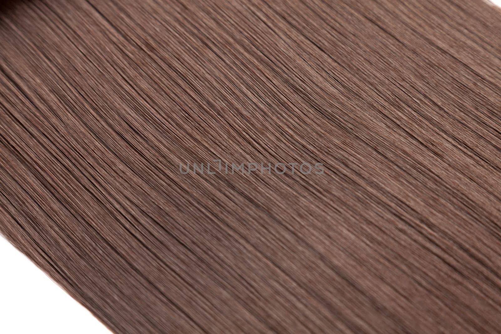 Closeup on luxurious straight glossy brown hair