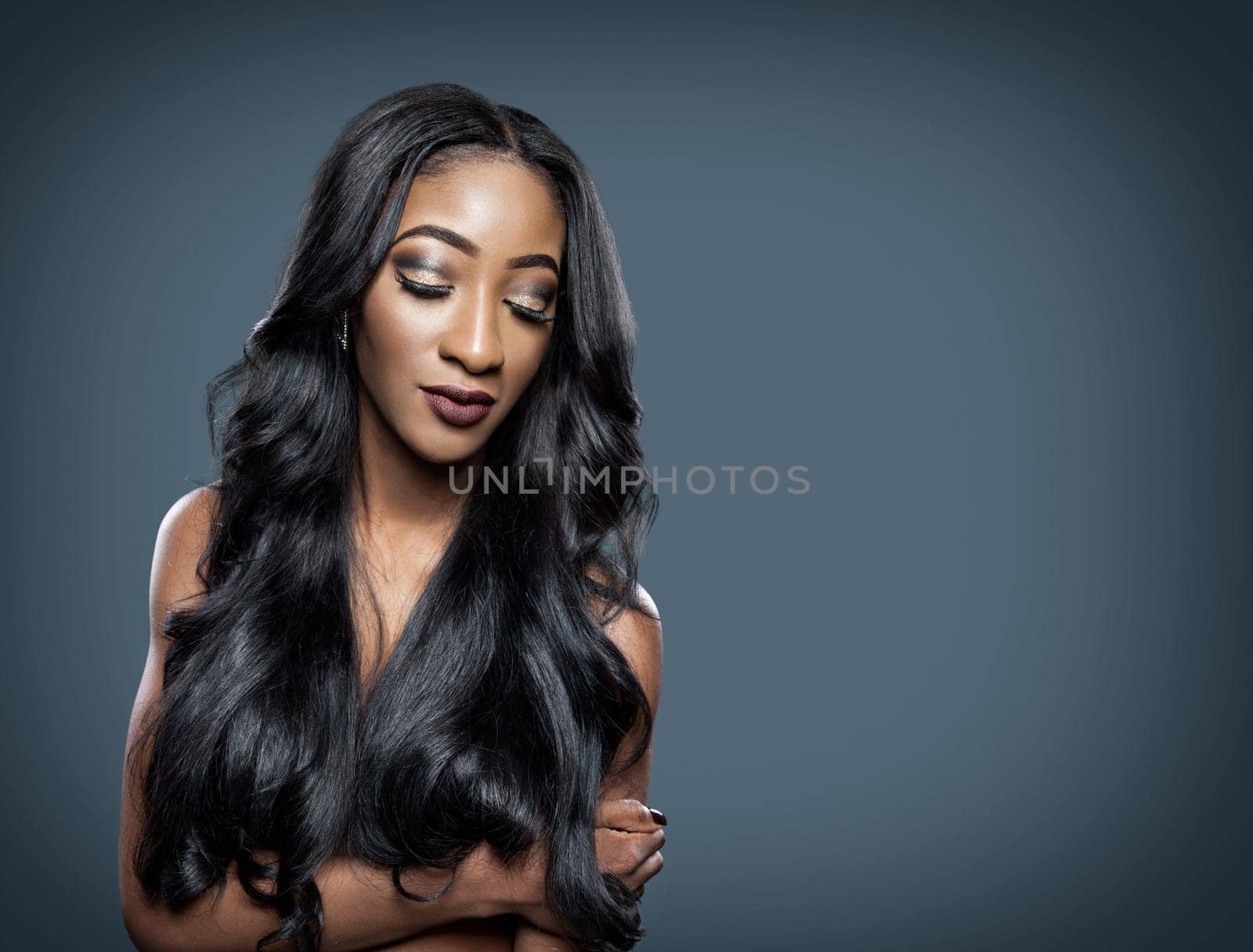 Black beautiful woman with long luxurious shiny hair