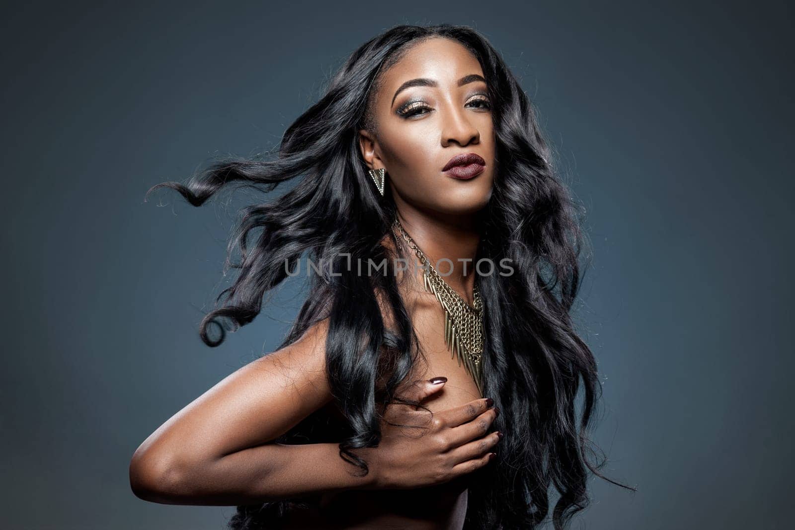 Black beautiful woman with long luxurious shiny hair