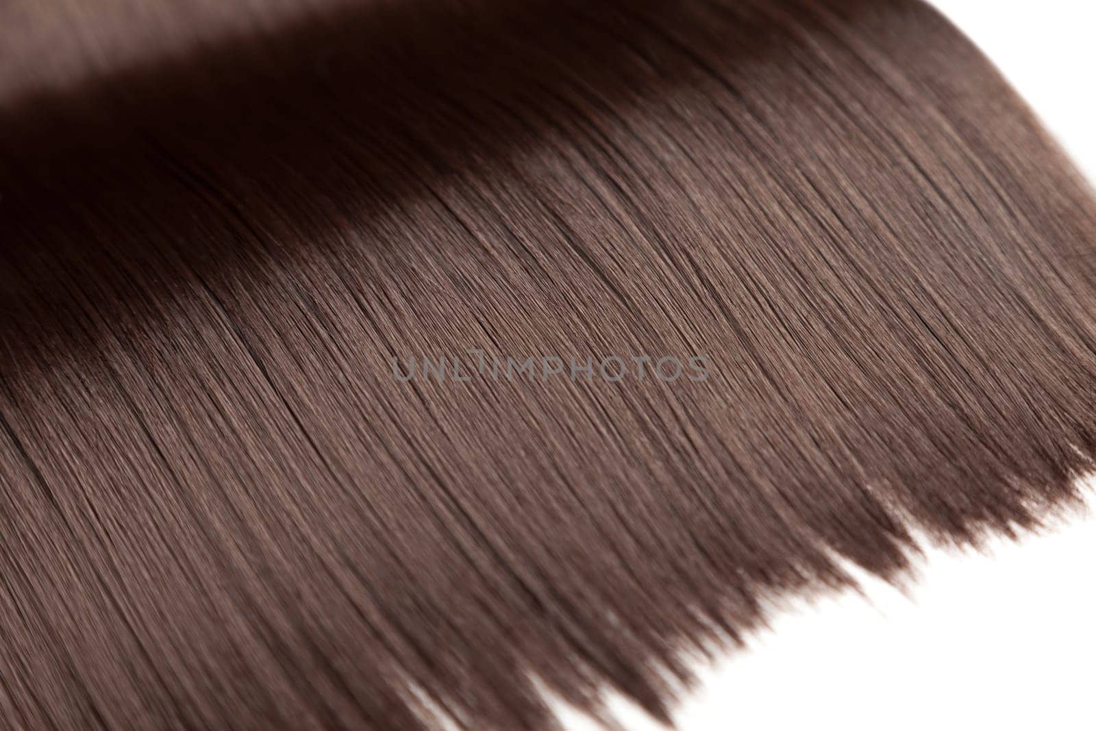 Closeup on luxurious straight glossy brown hair