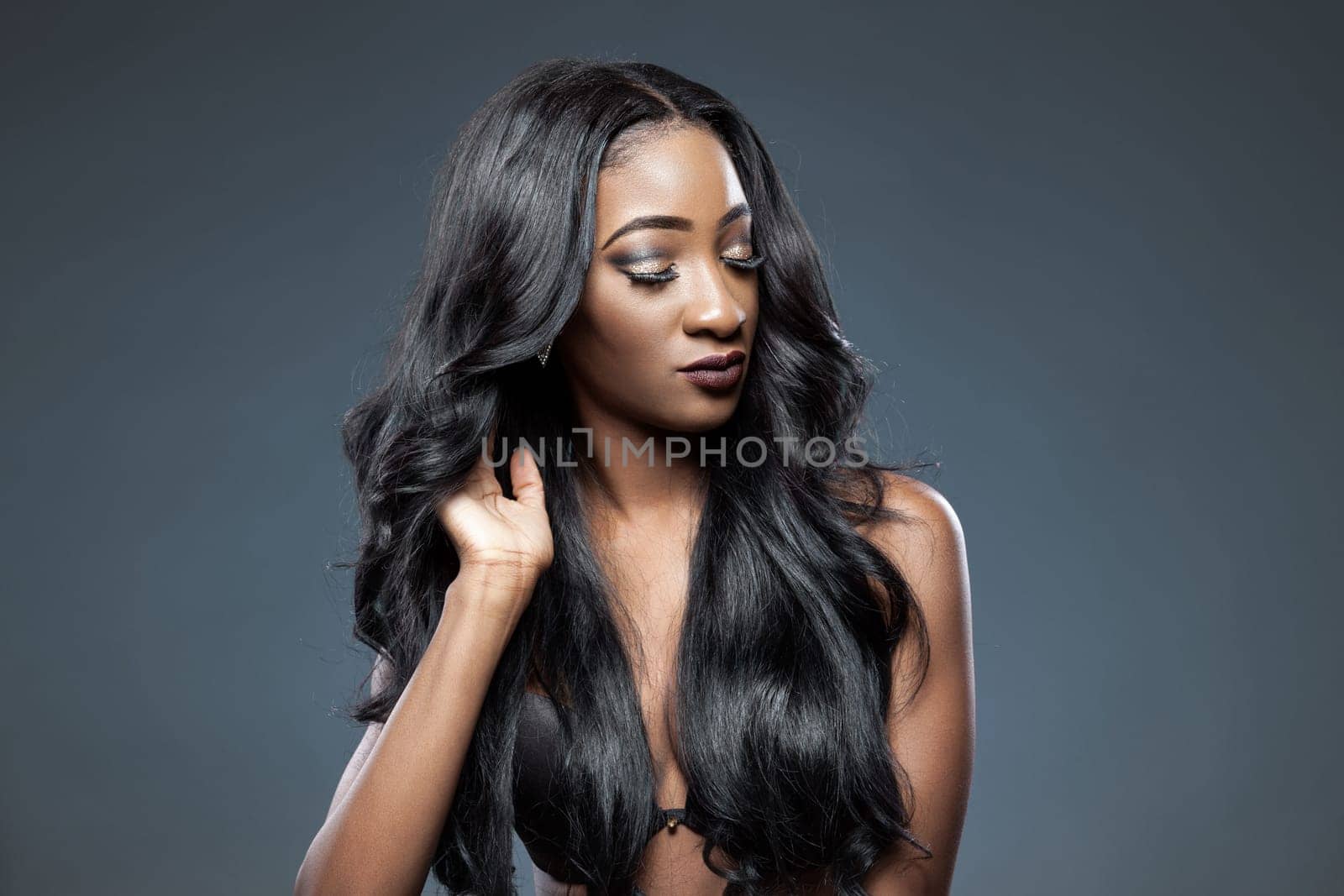 Black beautiful woman with long luxurious shiny hair