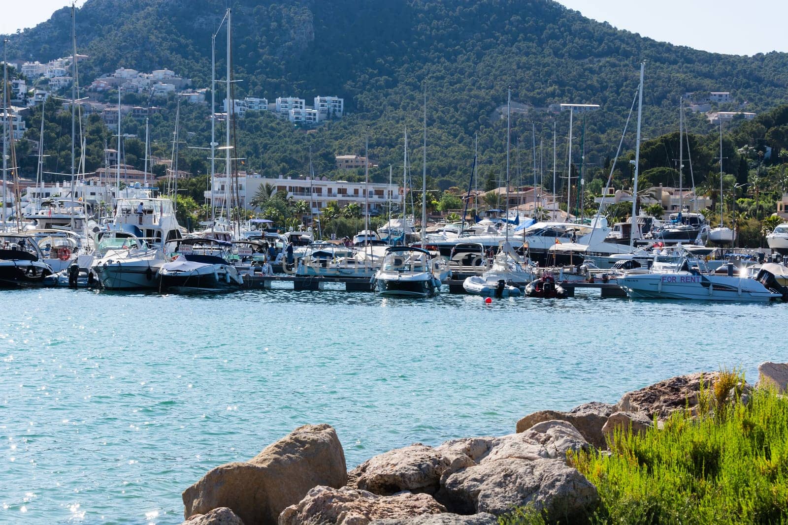 PORT ANDRATX, SPAIN - JUNE 01, 2016:.View of the Bay of Port Andratx Mallorca Baleares Spain. In the background motor boats and sailboats.