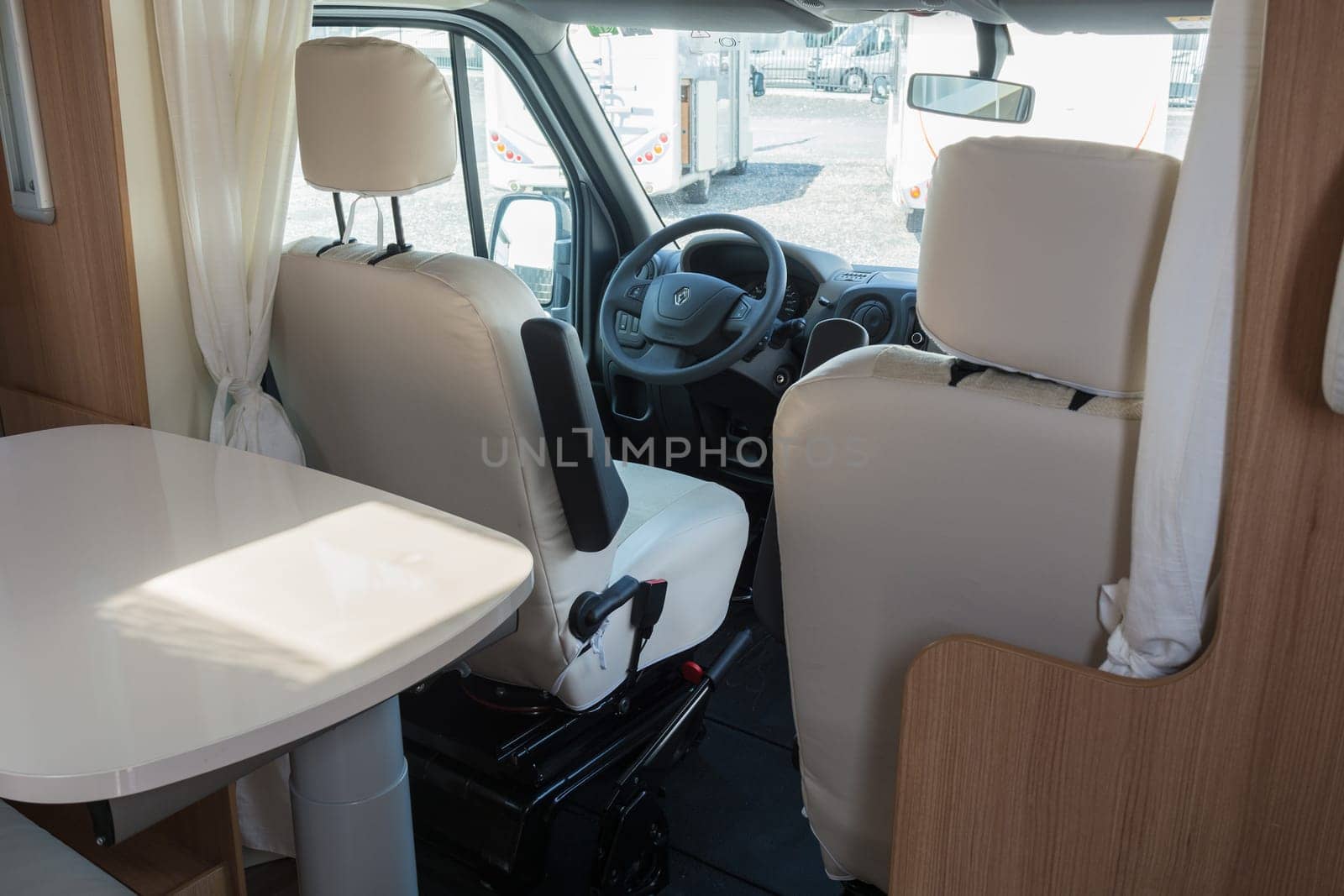 MUELHEIM RUHR  NRW  GERMANY - AUGUST 29  2017:.Vehicle interior view of a motorhome with a view of the steering wheel and driver as well as the passenger seat.