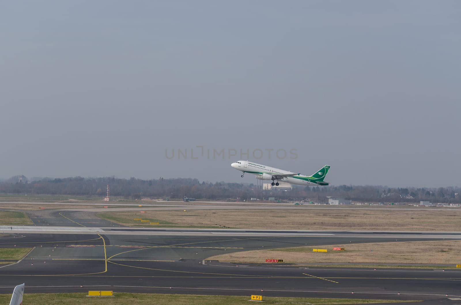 DUSSELDORF, NRW, GERMANY - MARCH 18, 2015:  Airbus A321 of Irak Airlines at startup on the Dusseldorf airport.
