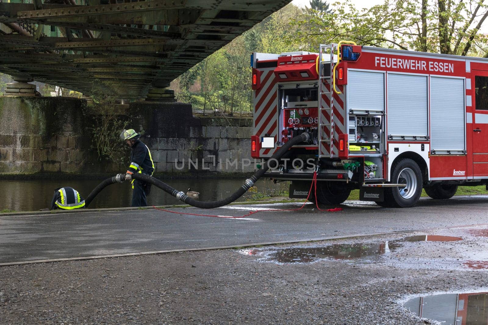 ESSEN KETTWIG, NRW, GERMANY - APRIL 28, 2016:.Fire fighter trainer use in Essen Kettwig, Germany. Firefighters in Uniform during training.