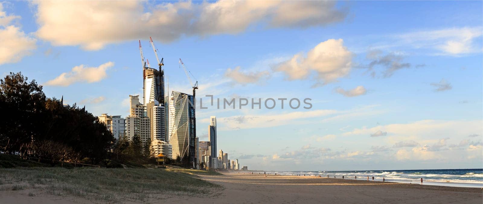 The skyscrapers of the Gold Coast seen from the beach at Broadbeach before sunset.
