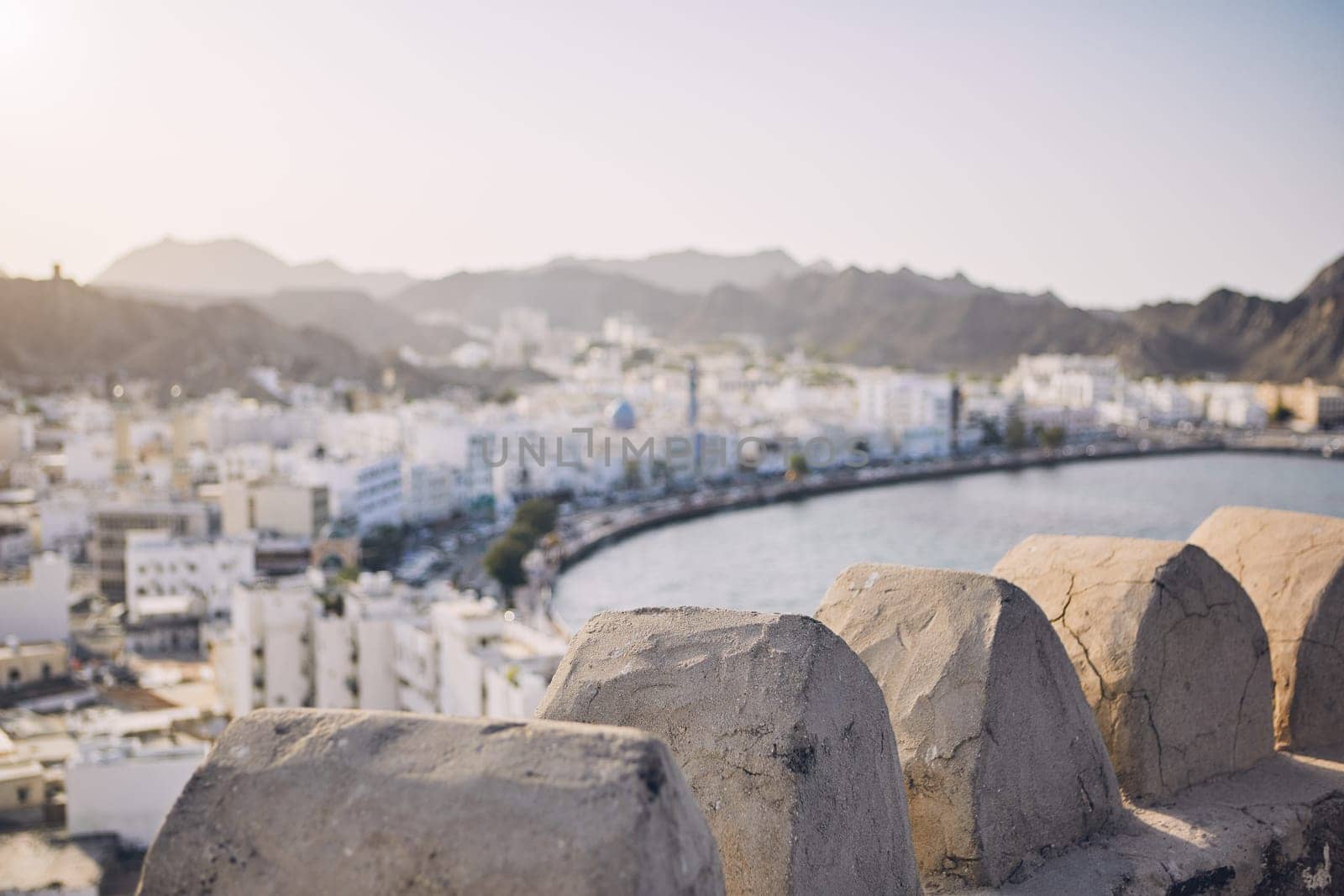 Muscat city at sunset. Selective focus on details of fort. Sultanate of Oman.