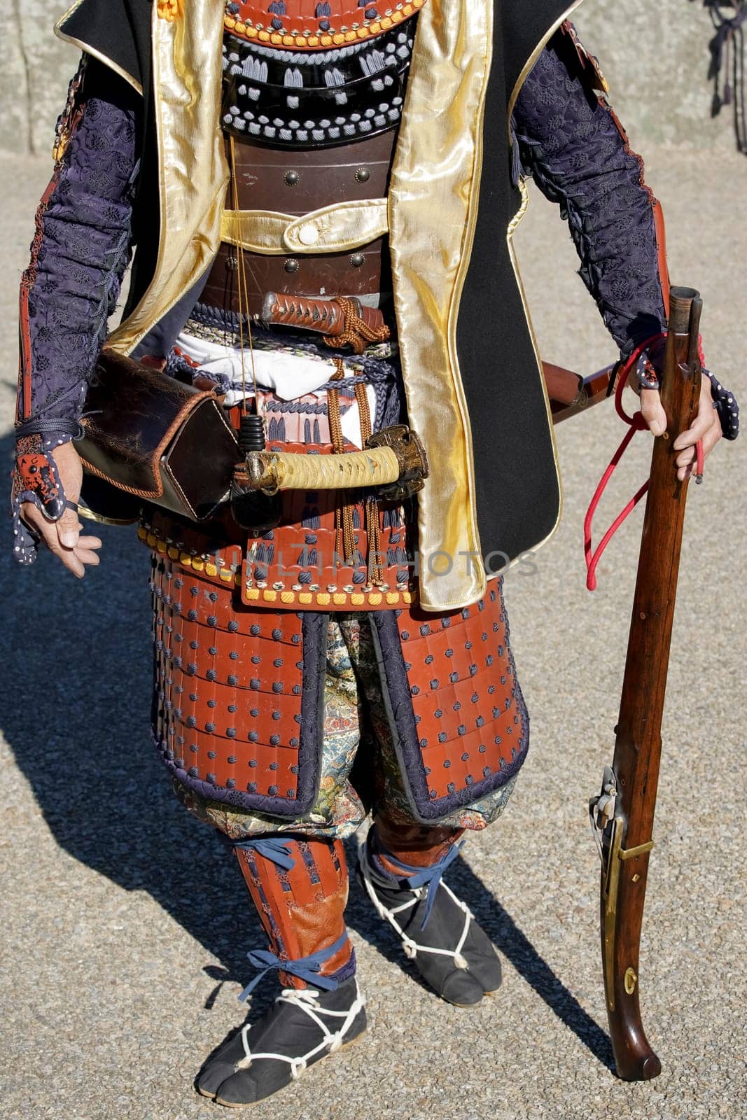 Japanese samurai clothing yoroi and kabuto uniform with old rifle