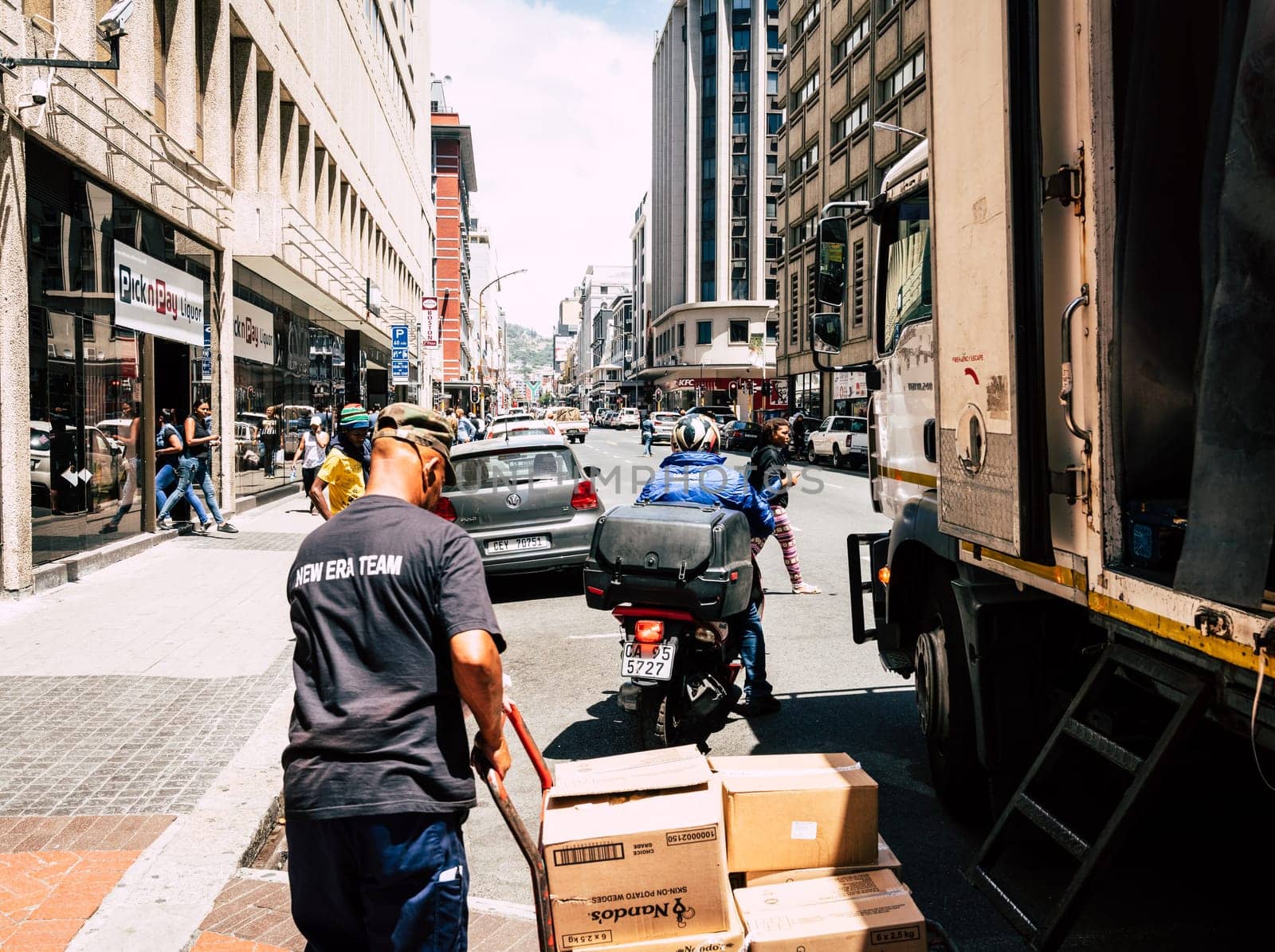 Cape Town, South Africa, February 9, 2018: Unloading delivery truck in downtown Cape Town, South Africa