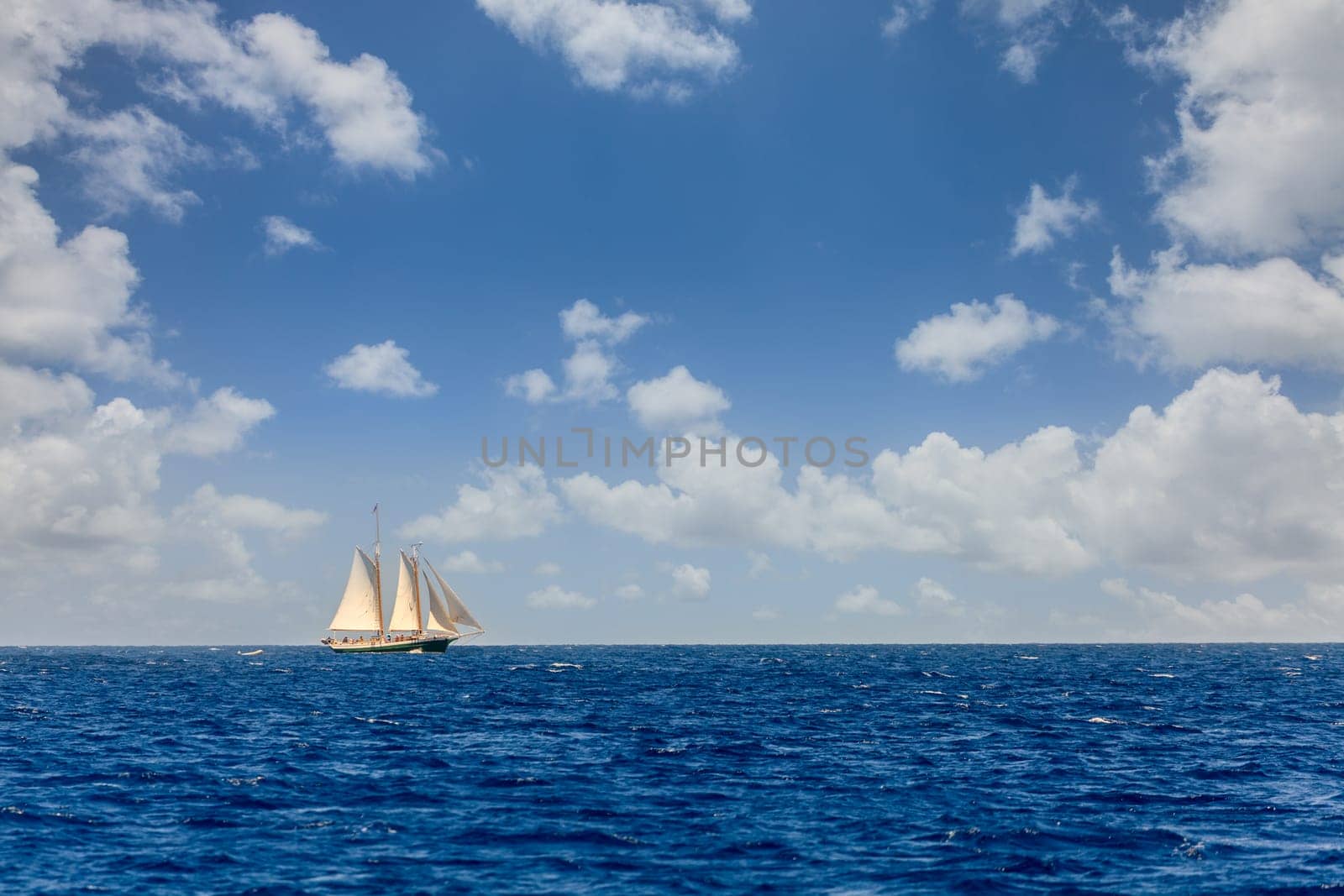 Sailboat on a bright sunny day in an open sea in British Virgin Islands