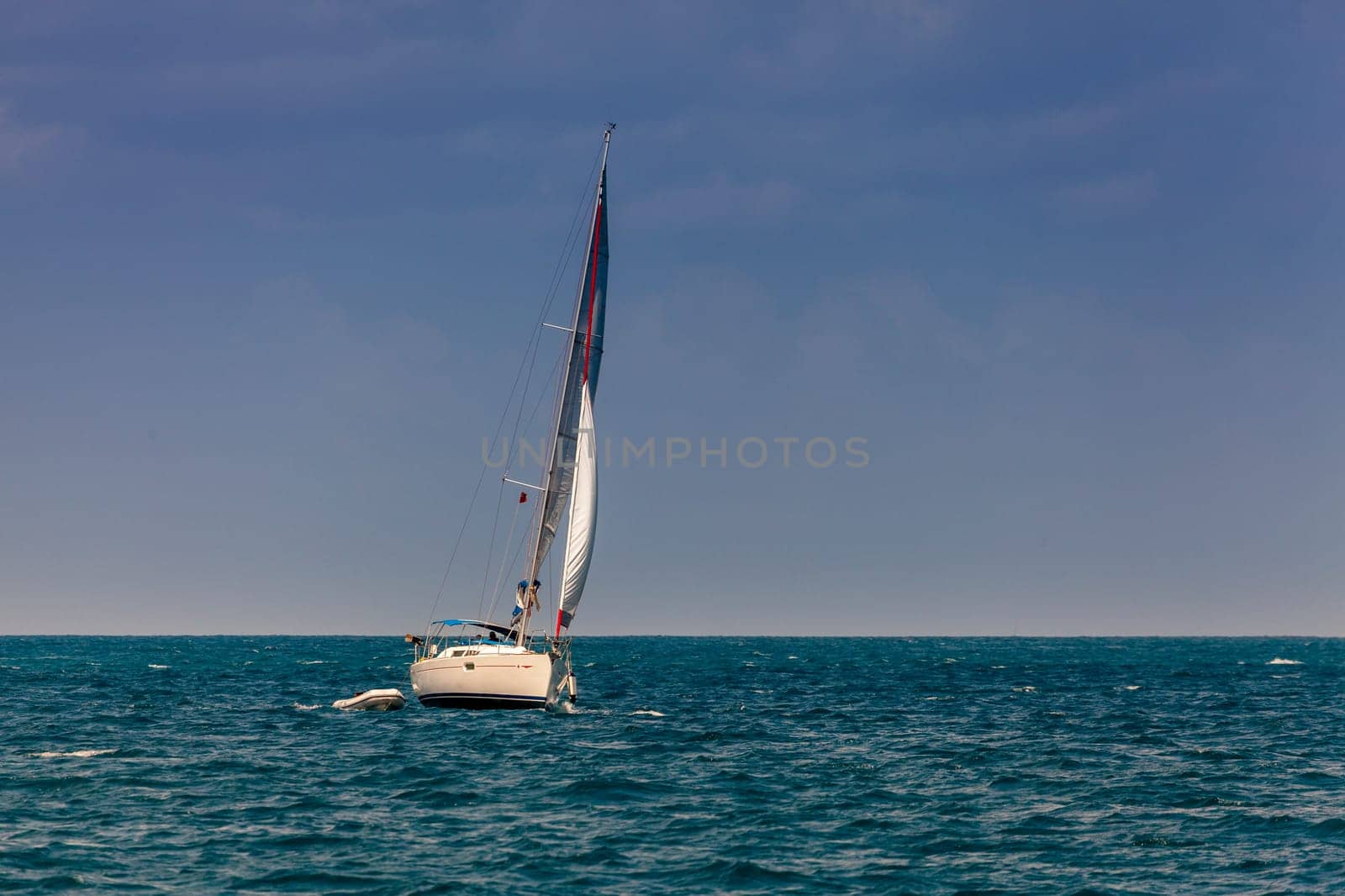 Sailboat on a bright sunny day in an open sea in British Virgin Islands