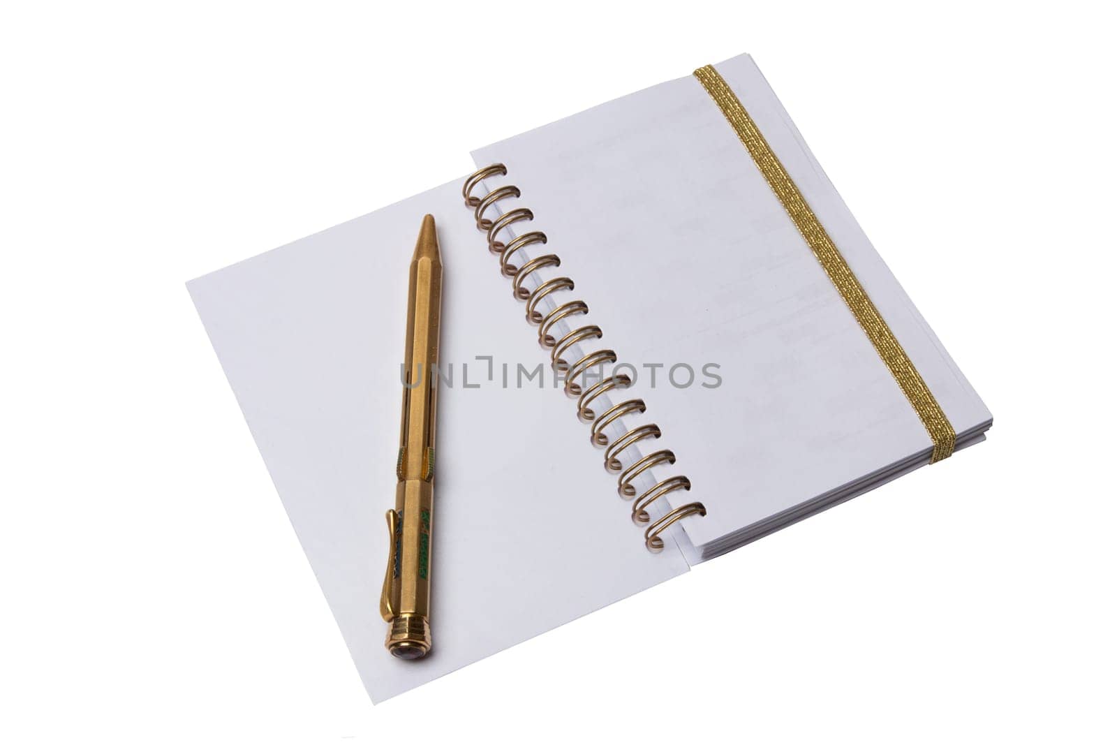 Notebook and pen. A open notebook with blank pages and an antique golden color pen isolated on a white background.
