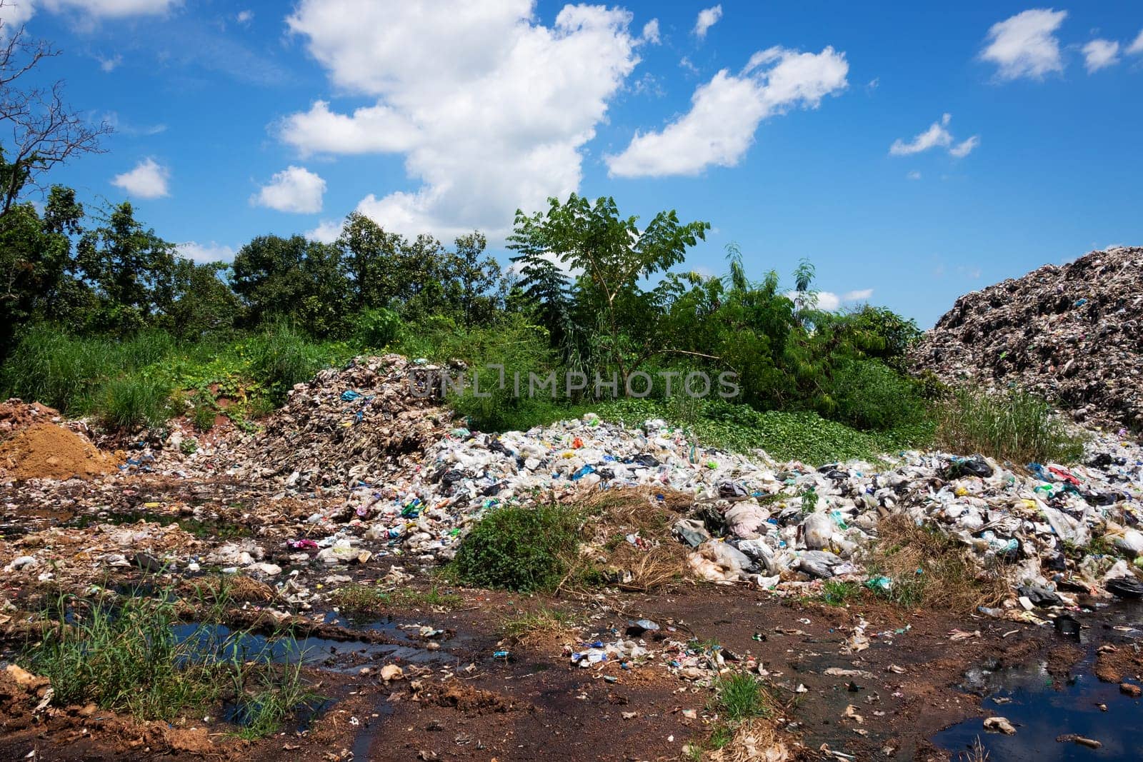 junkyard in the nature with blue sky and clouds