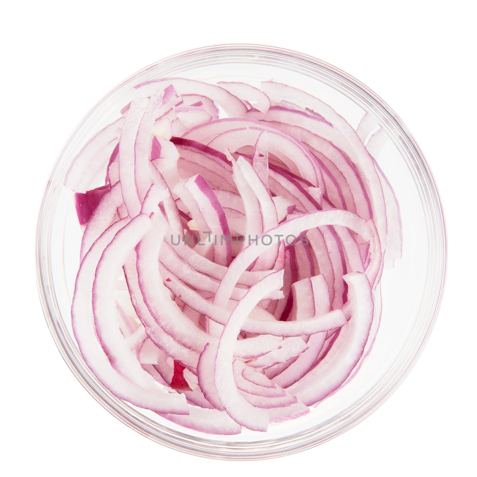 Sliced red onions in a glass bowl isolated on white and viewed from above