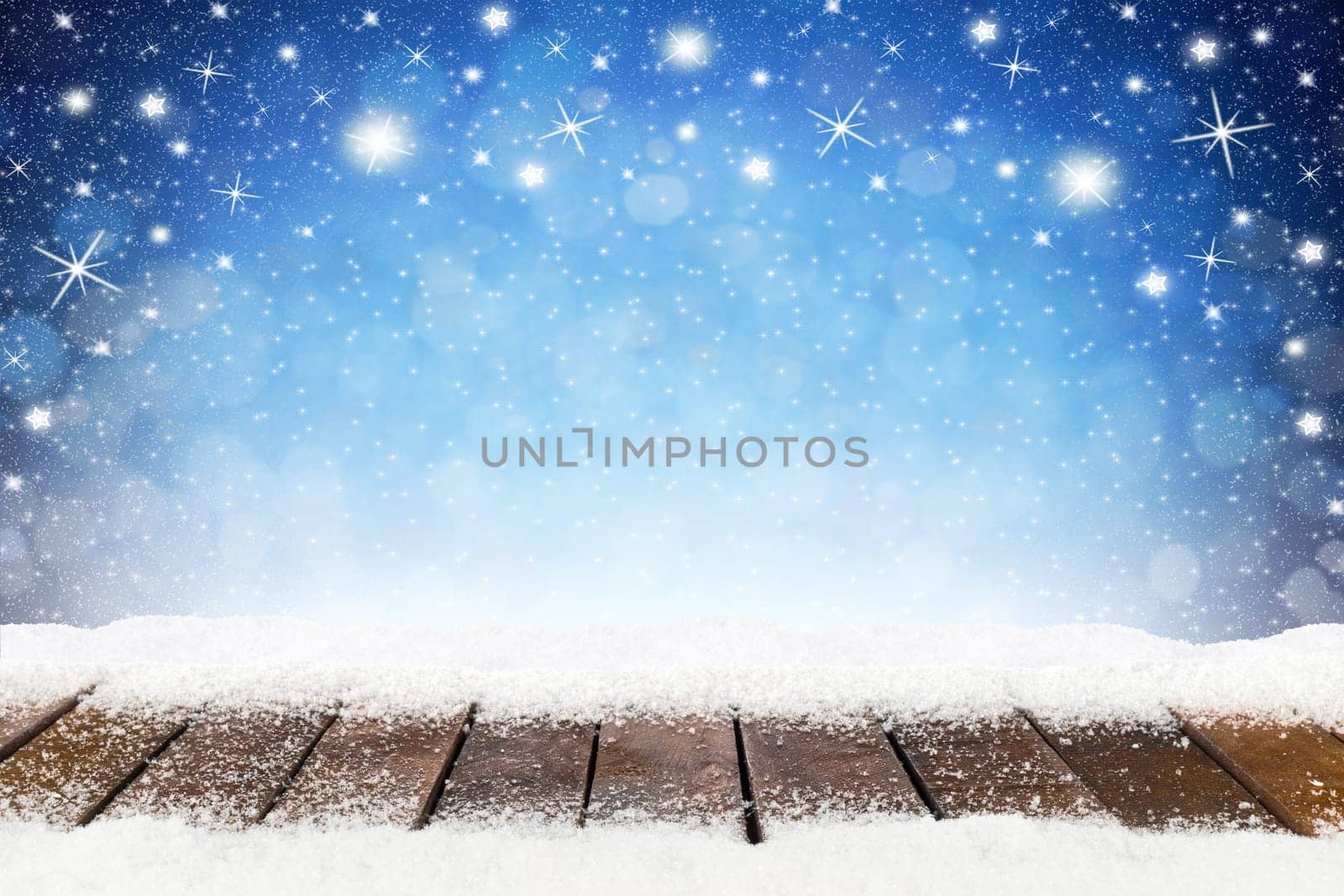 christmas xmas background with wooden snowy planks in front of blue night sky with stars and snowflakes