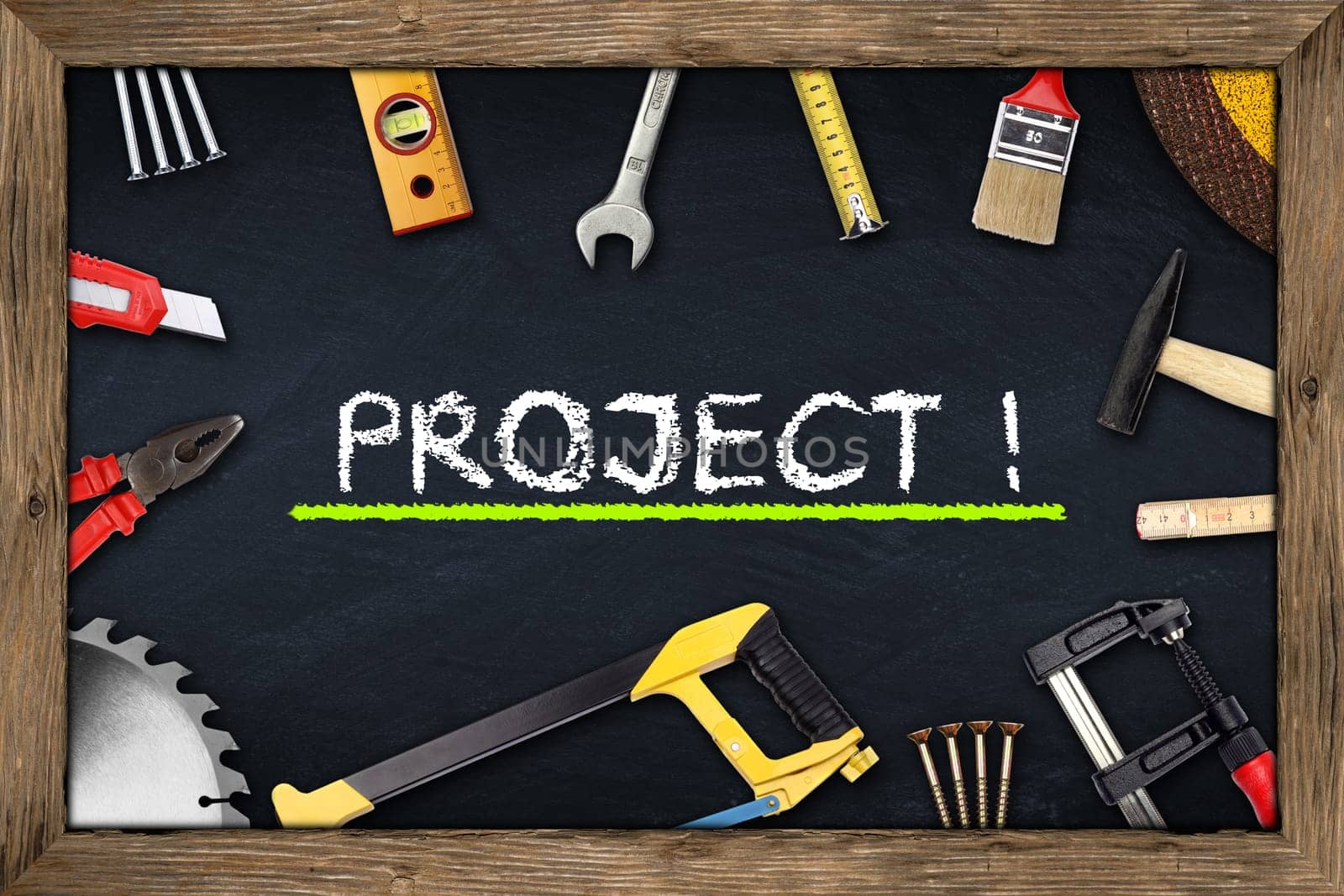 tools on project blackboard with wooden frame