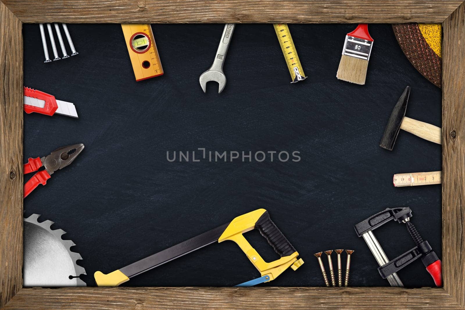 tools on blackboard with wooden frame