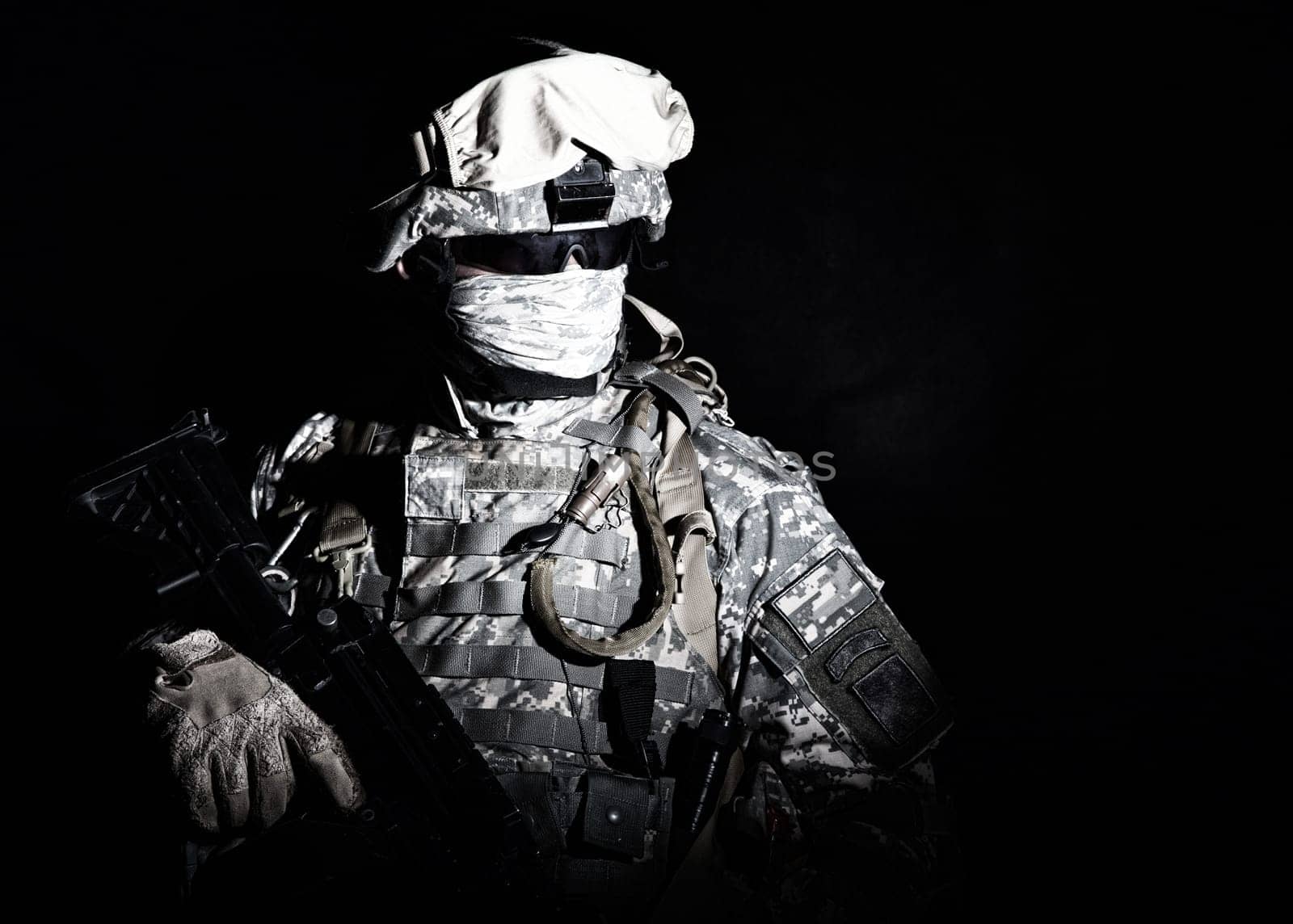 Armed infantry with hidden face standing during combat, counter terrorist night raid, protected perimeter control, state border patrolling and protecting