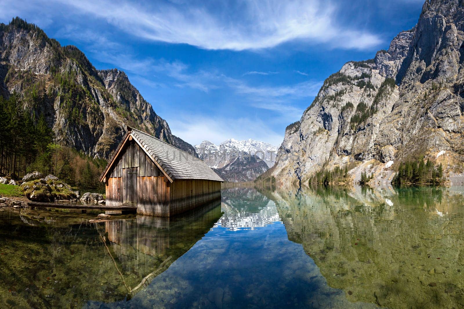 wooden house at lake in the mountains