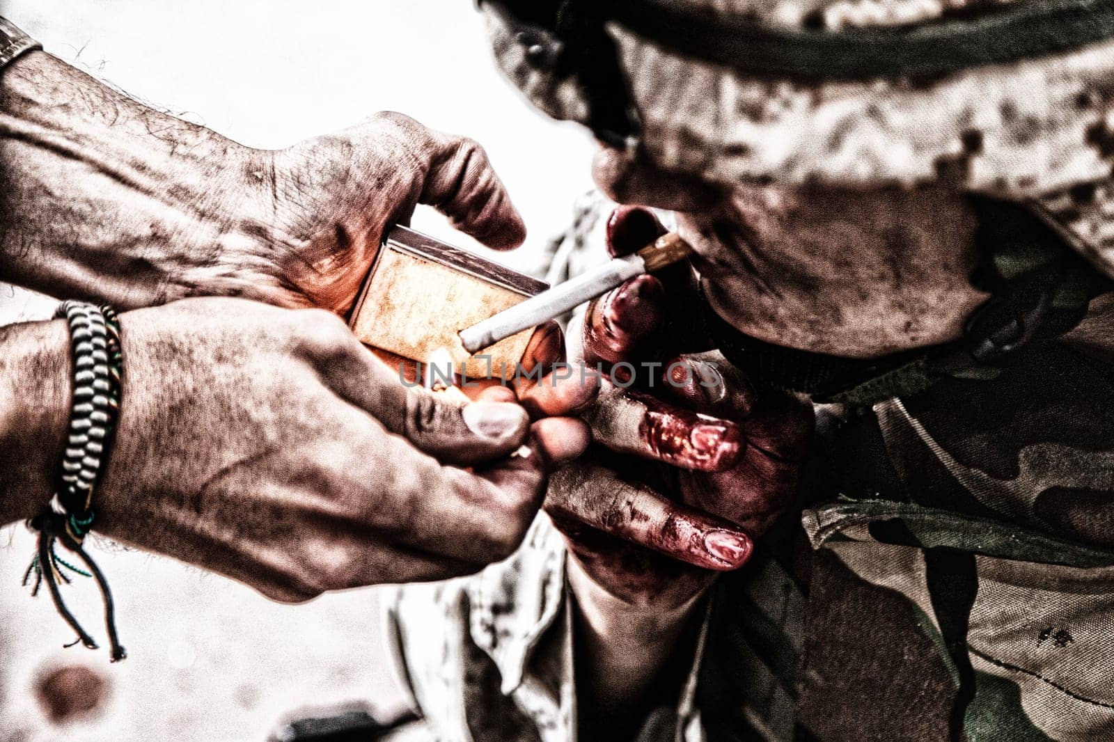 Wounded army soldier, tired military medics with fingers in blood, lighting cigarette with burning match in comrade palms. Psychological pressure, emotional trauma, post-traumatic disorder on war
