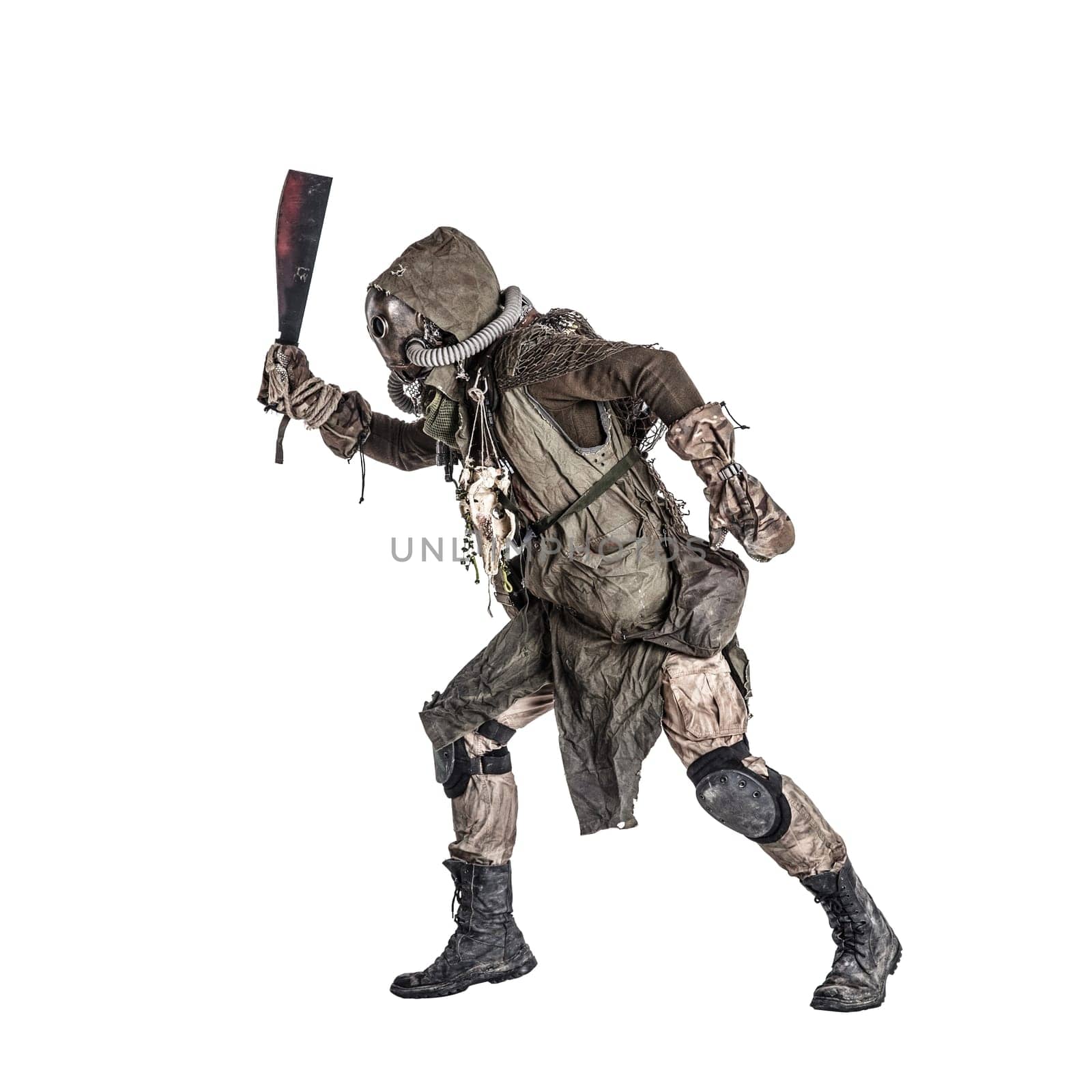 Aggressive and evil humanoid monster or creature of post apocalyptic, poisoned by dangerous pollution world wearing tattered rags and gas mask, brandishing bloodstained machete studio shoot on white