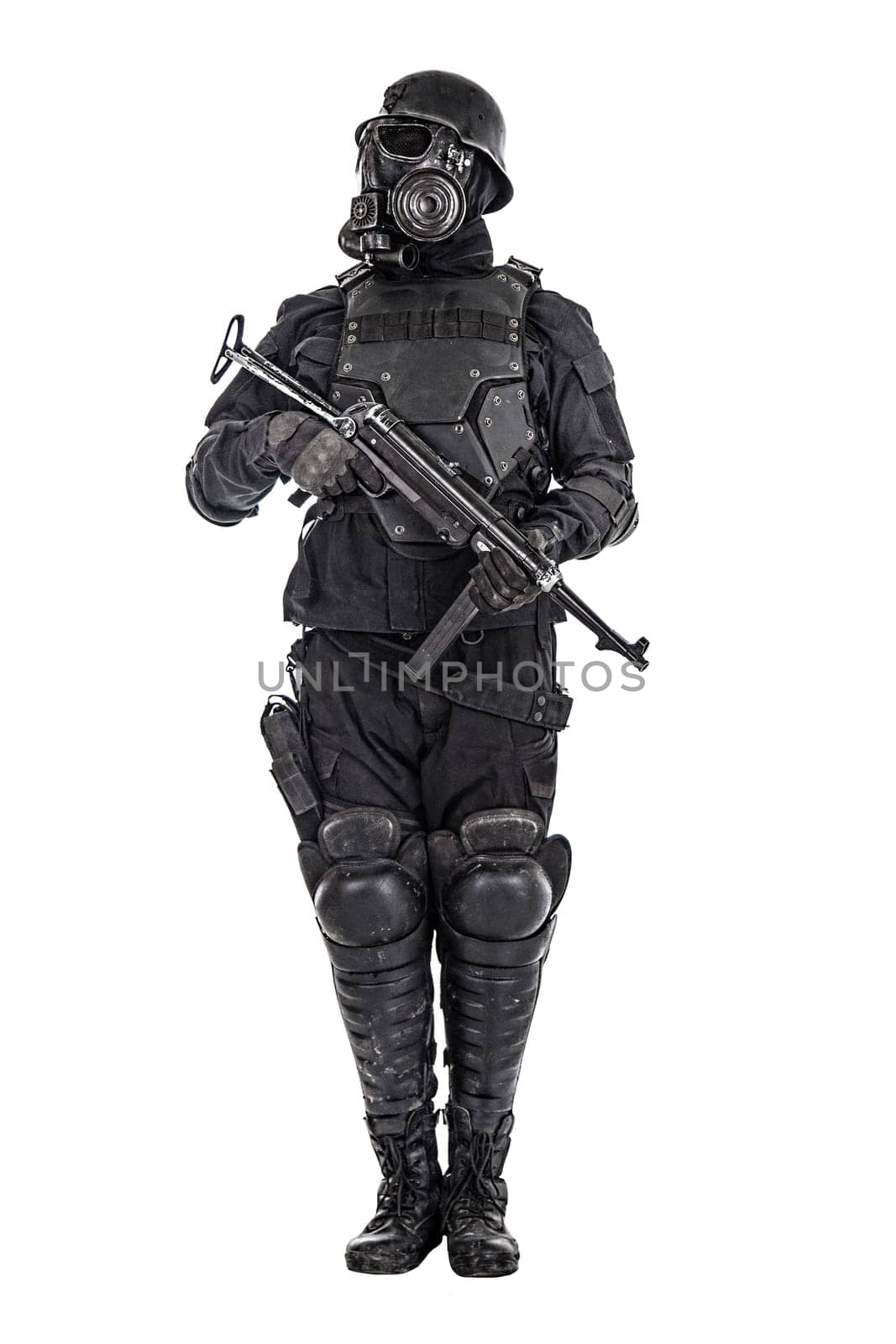 Futuristic nazi soldier gas mask and steel helmet with schmeisser handgun isolated on white studio shot standing to attention