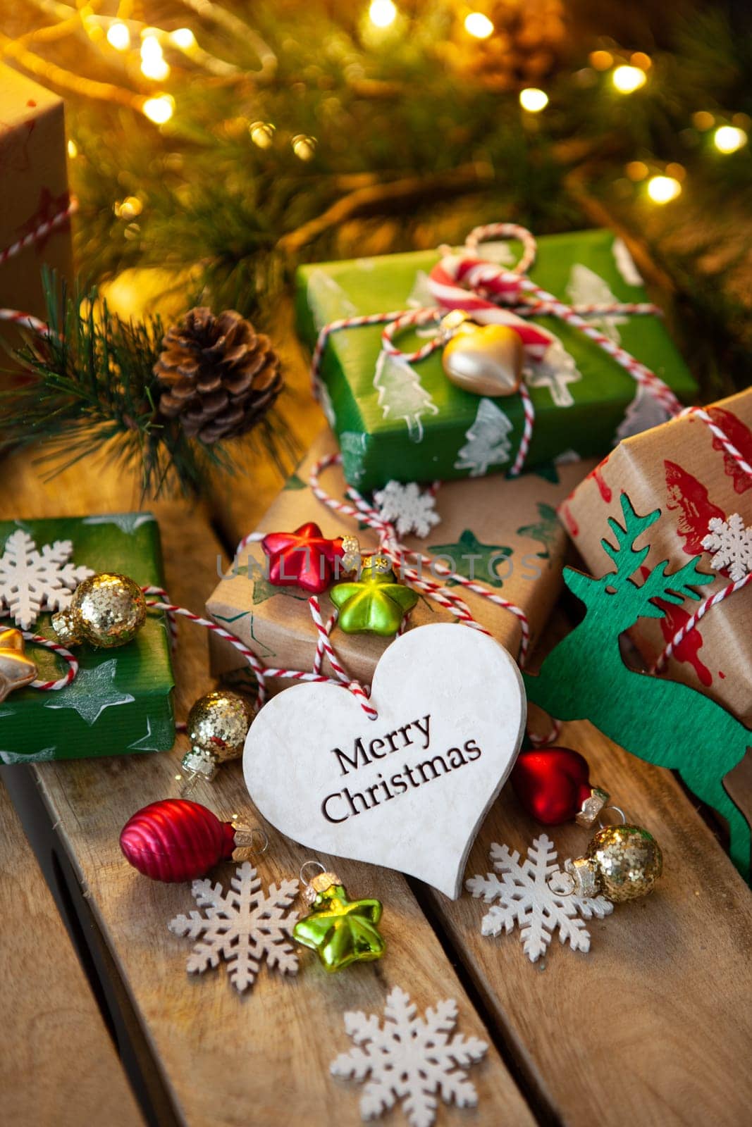 Little wrapped presents and festive lights for a Merry Christmas / Happy Holidays