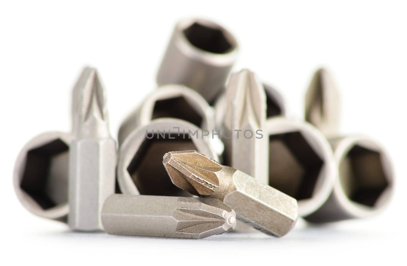 Composition with screwdriver heads of different size isolated on white background