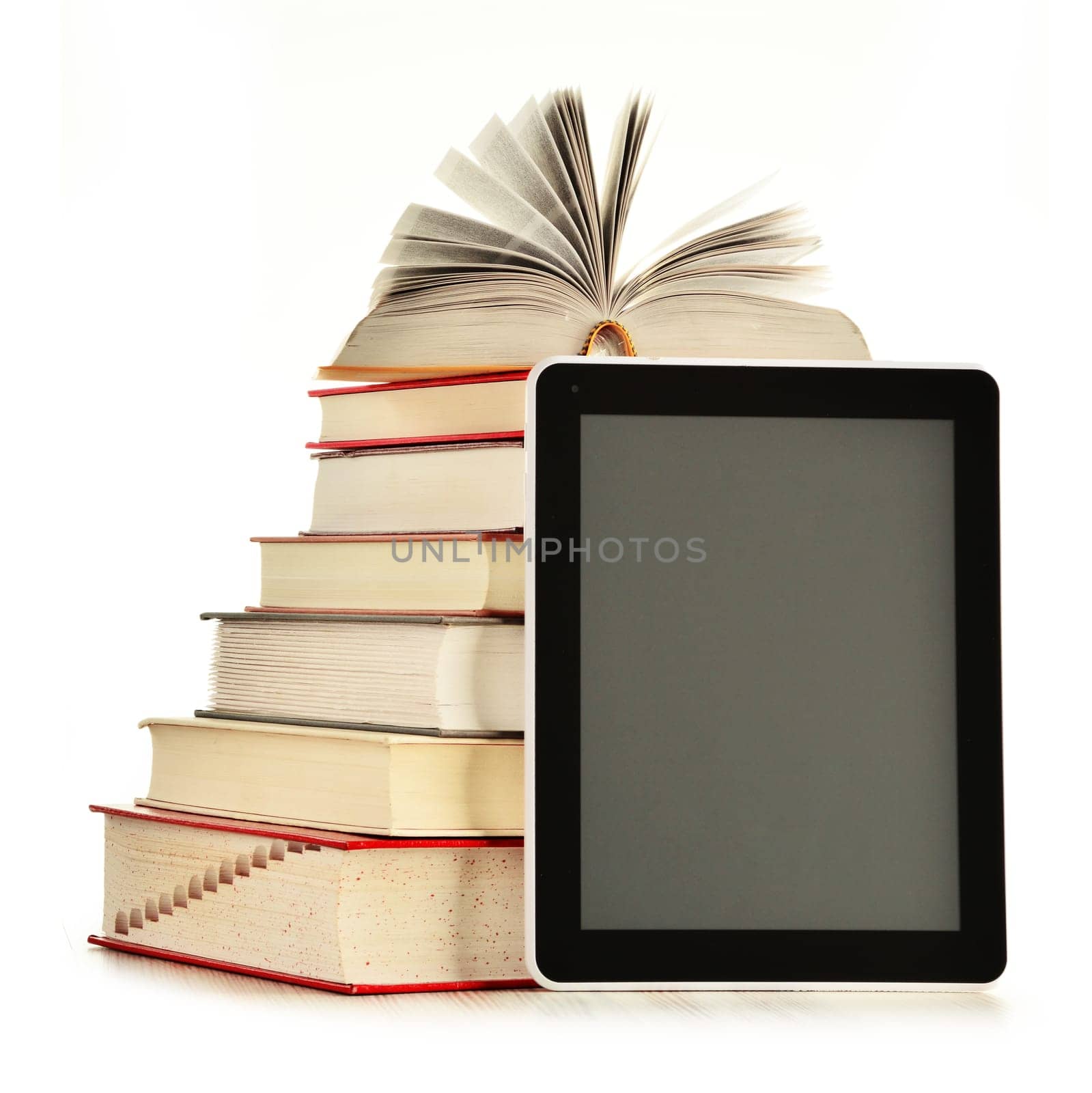 Composition with books and tablet computer isolated on white background