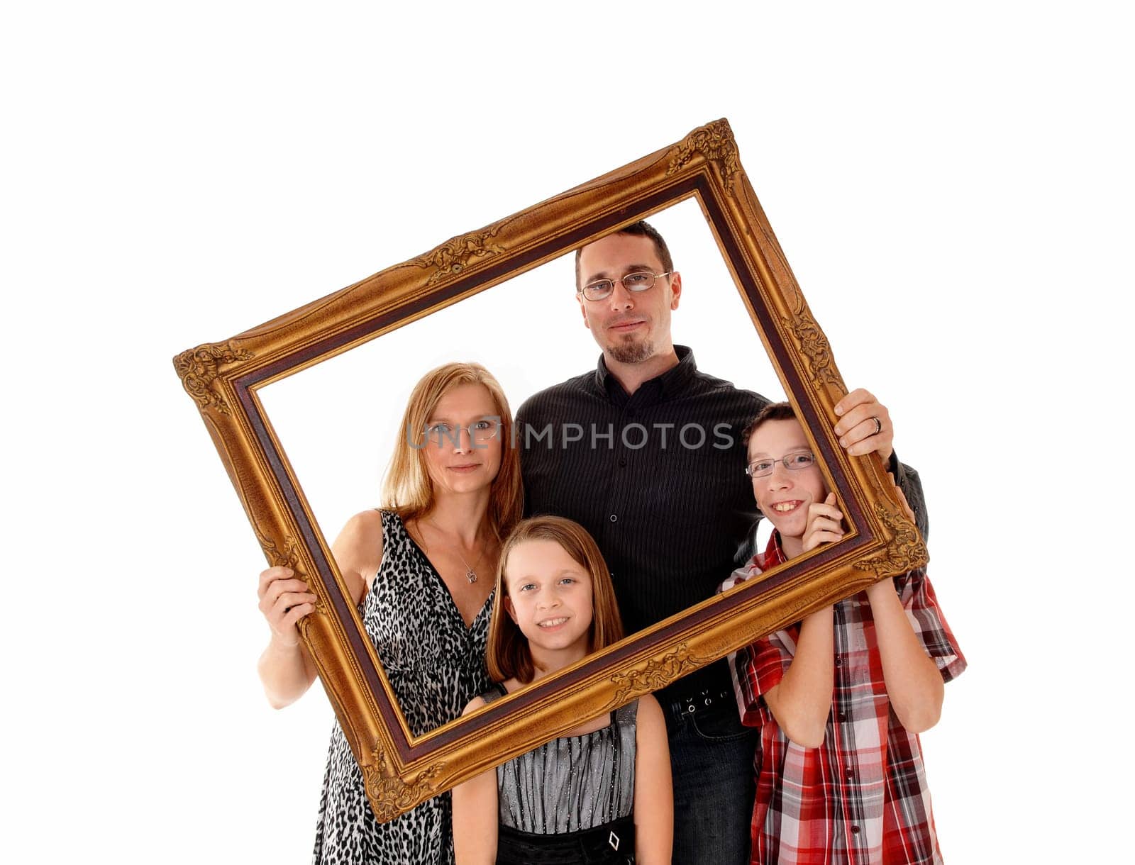 A young lovely family standing for white background and holding a.picture frame in front of them..