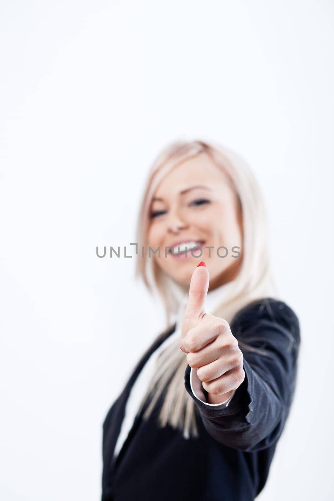 thumbs up succesful woman and smile with a blue jacket